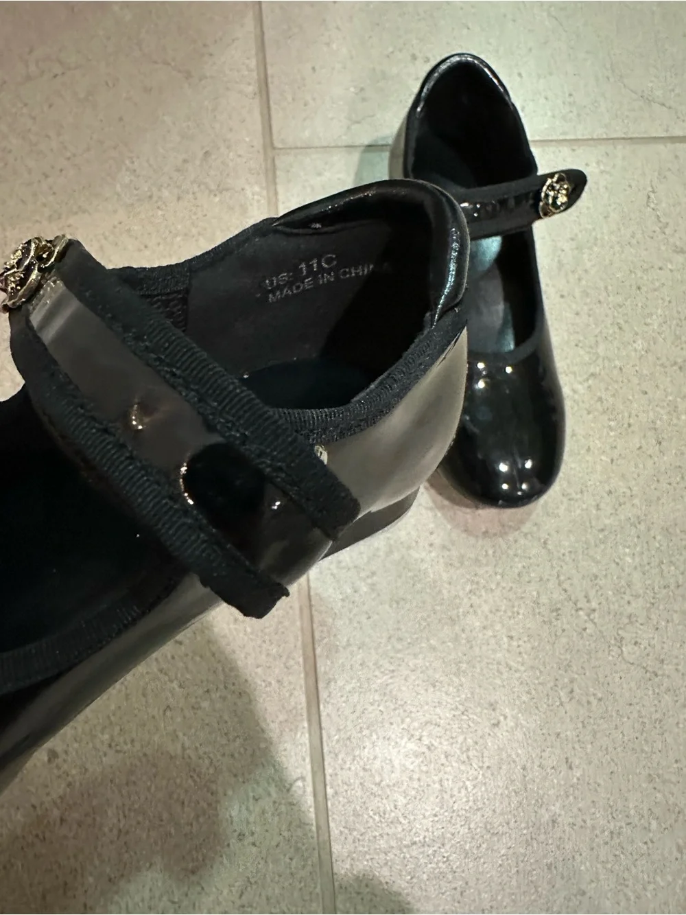 Girls Black Patent Tap Dress Shoes with Floral Accent’s Strap